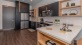 a kitchen with black cabinets