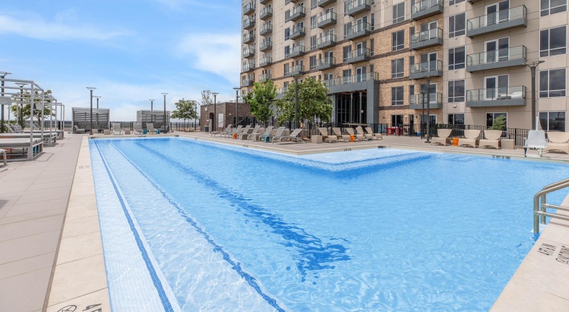 a swimming pool in front of a building